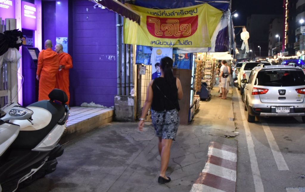 Monks using an ATM in Thailand